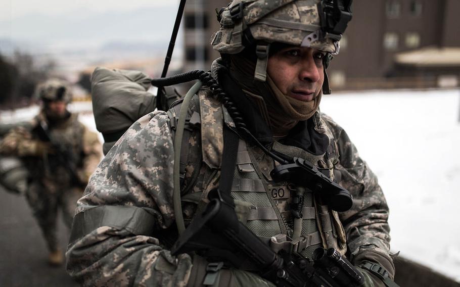 Soldiers from 1st Battalion, 5th Cavalry Regiment march through Camp Stanley, South Korea, Friday, Dec. 15, 2017.