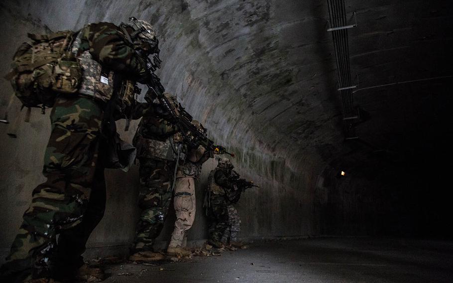 Soldiers from 1st Battalion, 5th Cavalry Regiment move into the underground facility at Camp Stanley, South Korea, Friday, Dec. 15, 2017.