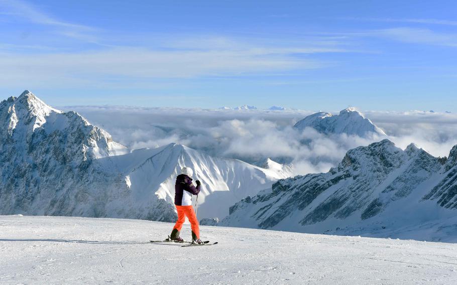 A skier atop the Zugspitze, Germany's tallest mountain, near Garmisch, Germany, Tuesday, Dec. 19, 2017.