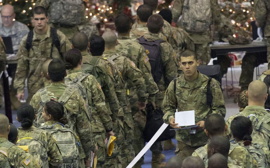 Trainees stand in line for processing at the Solomon Center at Fort Jackson, S.C., on Monday, Dec. 18, 2017, as they prepare for Victory Block Leave. Rougly 6,000 trainees from Fort Jackson will be traveling home for the holidays before coming back to their post to continue training.