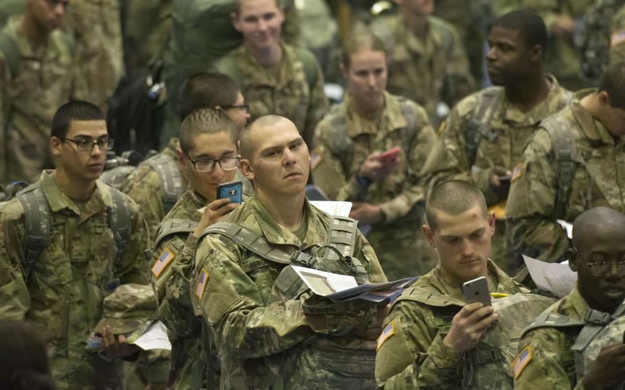A trainee stands in line for processing at Fort Jackson, S.C., on Monday, Dec. 18, 2017, as he prepares to depart on Victory Block Leave. Rougly 6,000 trainees from Fort Jackson will be traveling home for the holidays.
                