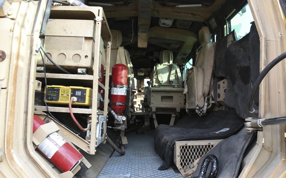 The interior cabin of an RG-33, like the one damaged in a Nov. 13, 2017, suicide car bomb attack in Kandahar province, Afghanistan, is pictured here on Wednesday, Dec. 20, 2017, at Bagram Air Field. Each RG-33 vehicle contains several fire extinguishers in the cabin, but Sgt. Joshua Sears struggled to dislodge one to put out a fire on the vehicle that had been damaged in the Nov. 13 attack. 
                