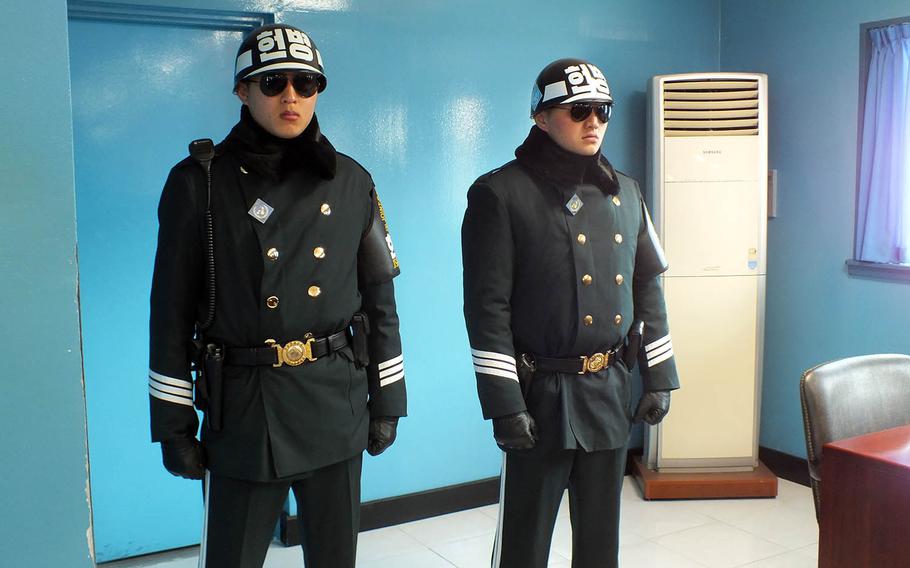 South Korean soldiers stand guard last year inside a conference room at the Joint Security Area of the Demilitarized Zone.