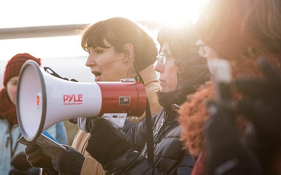 Army veteran Nichole Bowen-Crawford, left, speaks Monday, Jan. 8, 2018 during a demonstration outside the Pentagon. She talked about being sexually assaulted during a deployment to Iraq and said she was silenced by her commanders. Bowen-Crawford traveled from Washington State to participate in the #metoomilitary Stand Down organized by the Service Women's Action Network, an effort to highlight sexual harassment and assault issues in the military. 