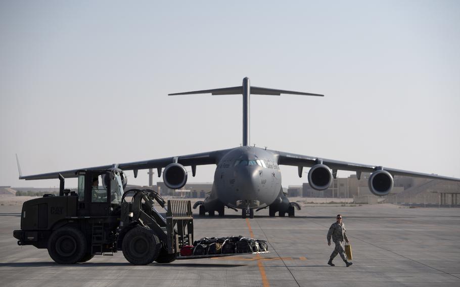 A U.S. Air Force C-17 Globemaster III is loaded at Al Udeid Air Base, Qatar, Dec. 21, 2017. Qatar wants to make the air base more family friendly for U.S. forces in the hopes that the strategic military hub will be counted as one of the Pentagon's permanent overseas installations.