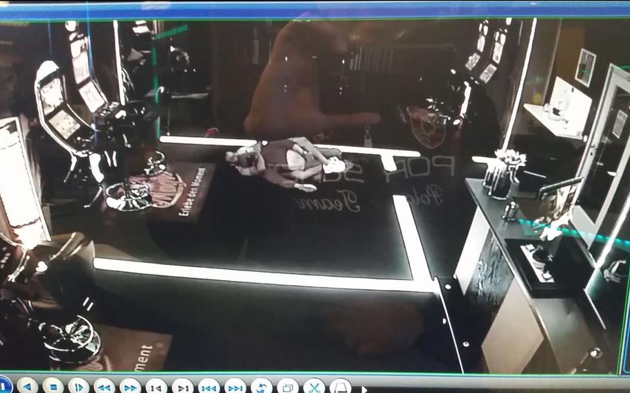 In this screen shot from a surveillance camera, Elliot Montalvan grapples an armed perpetrator when the man attempted to rob a casino in 2017.