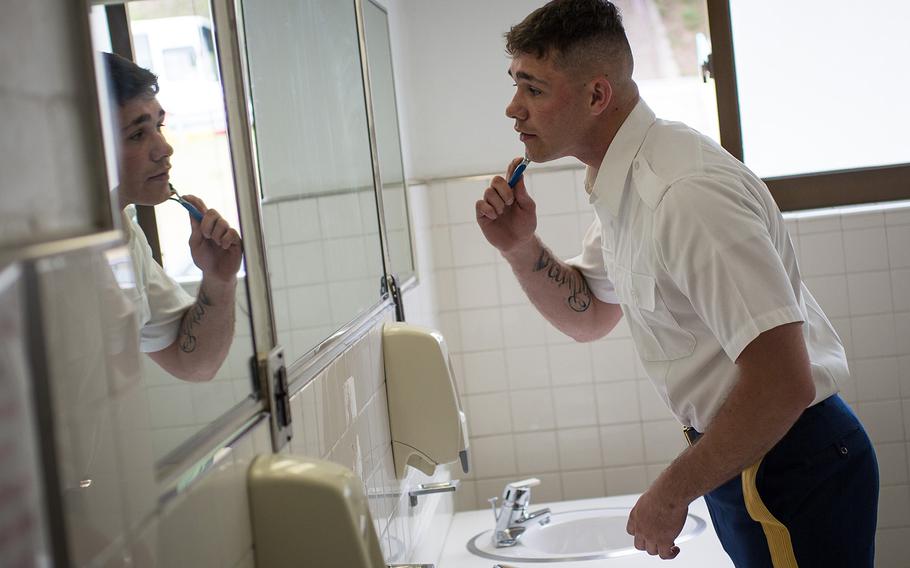 A soldier assigned to the U.N Honor Guard shaves before a ceremony at Yongsan Garrison, South Korea, June 11, 2017.