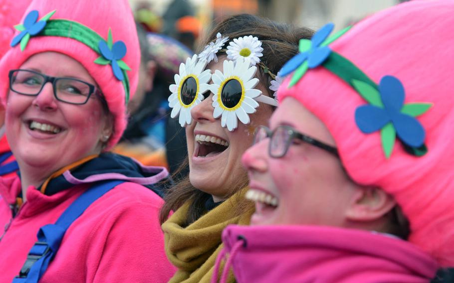The revelers are decked out in all kinds of colorful costumes for Weiberfastnacht, or women's carnival, in Mainz, Germany, Thursday, Feb. 8, 2018.
