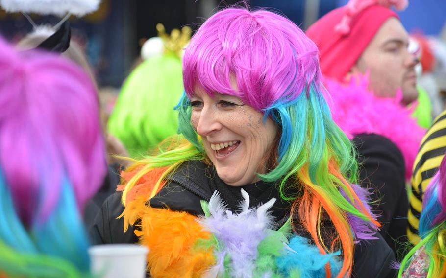 A costumed reveler celebrates Weiberfastnacht, or women's carnival, in Mainz, Germany, Thursday, Feb. 8, 2018.