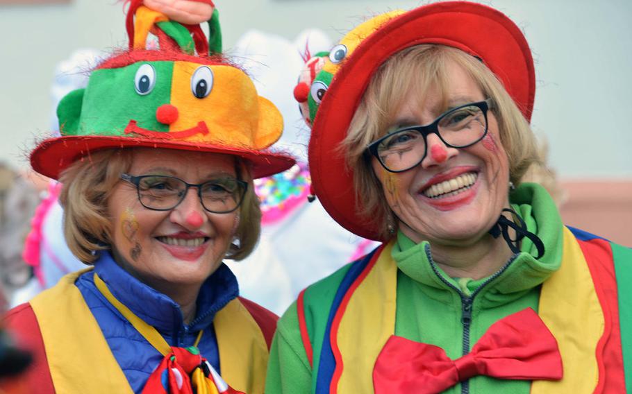 Revelers wear all kind of colorful costumes for the Weiberfastnacht, or women's carnival, celebrations in Mainz, Germany, Thursday, Feb. 8, 2018.