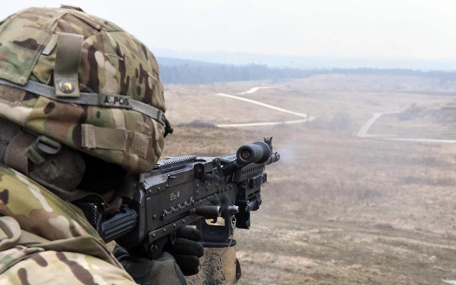 Sgt. John Kopeck fires an M240 machine gun mounted to an M1120 HEMTT Load Handling System during live-fire training at Grafenwoehr, Germany, Thursday, Feb. 8, 2018.