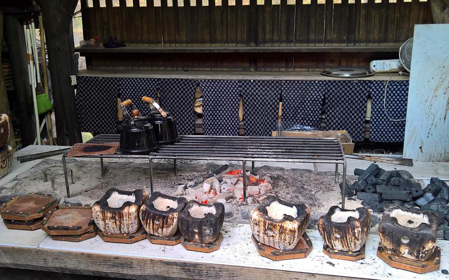 A grill at Irori Sanzoku near Marine Corps Air Station Iwakuni, Japan, simmers with hot coals.
