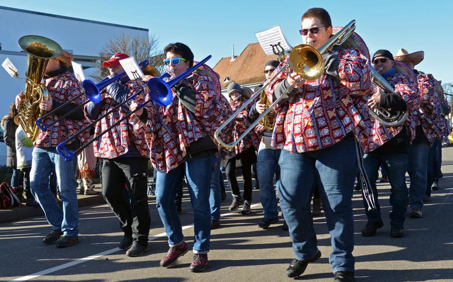 A local brass band participates in the 67th annual Ramstein-Miesenbach Fasching parade Tuesday, Feb. 13, 2018.