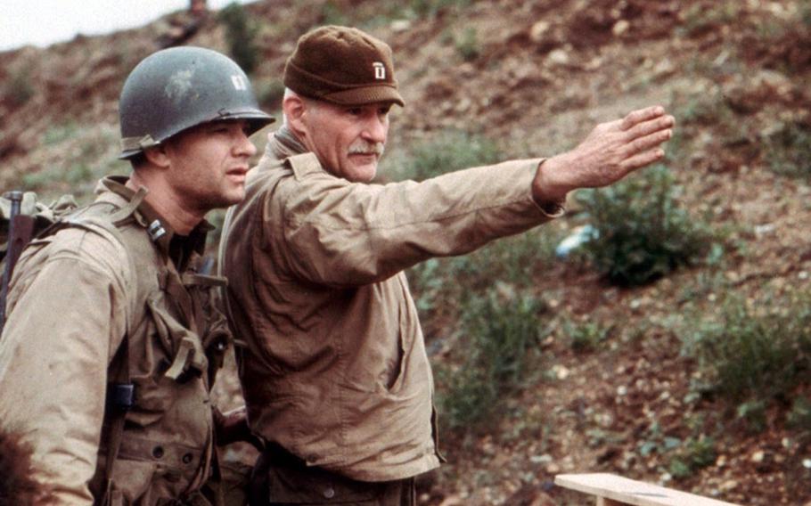 Dale Dye directs Tom Hanks on the set of Steve Spielberg's "Saving Private Ryan." Dye, a Marine combat veteran, served as a technical adviser and actor on the film.