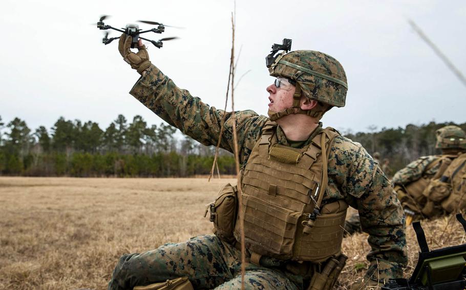 Lance Cpl. James R. Fiers Jr., a rifleman with Battalion Landing Team, 2nd Battalion, 6th Marine Regiment, 26th Marine Expeditionary Unit, launches a drone during live-fire training at Camp Lejeune, N.C., Jan. 17, 2018.