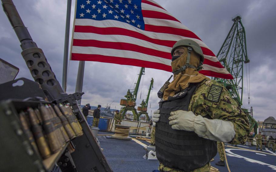 Ship's Serviceman Seaman Darnell Thomas mans a .50-caliber machine gun aboard the guided-missile destroyer USS Carney, while mooring in Varna, Bulgaria, Feb. 18, 2018.