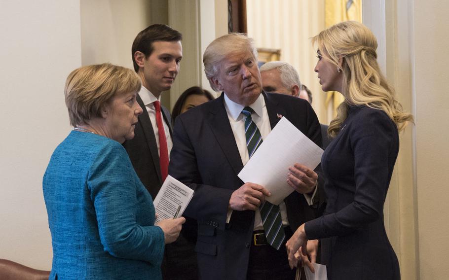 President Donald Trump talks with German Chancellor Angela Merkel, Friday, March 17, 2017, in the outer Oval Office, joined by Senior White House Advisor Jared Kushner and Ivanka Trump. According to a new poll, Germans have soured on their relationship with the United States since Trump's election.