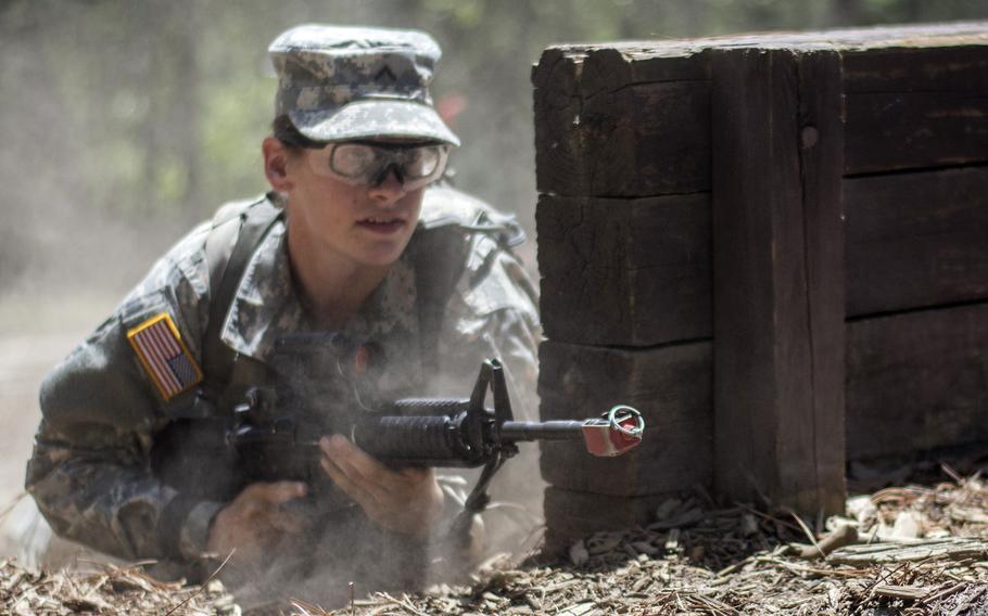 U.S. Army recruit Madison Elam, 19, of Vandalia, Ohio, rushes into position to cover her battle buddy during basic training at Fort Jackson, S.C., in 2015. A new study found that unit cohesion was unaffected by adding women.