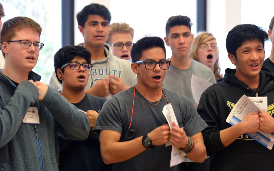 Members of the choir go through a number at the DODEA-Europe Honors Music Festival, Tuesday, March 13, 2018.