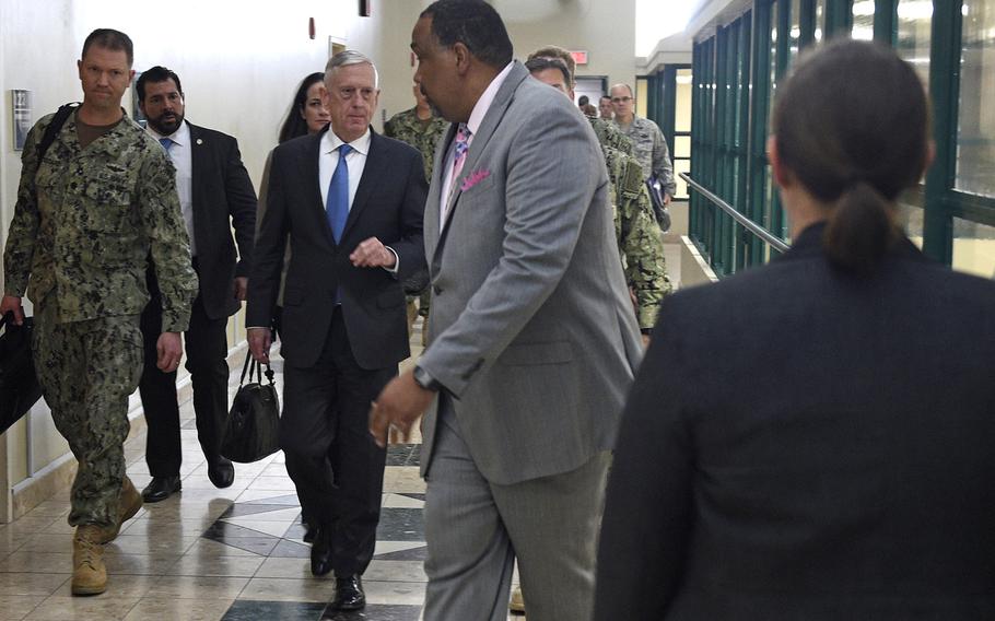 Defense Secretary Jim Mattis arrives at an auditorium at Naval Support Activity Bahrain for an all hands call on March 15, 2018. Mattis took questions from servicemembers during the event.