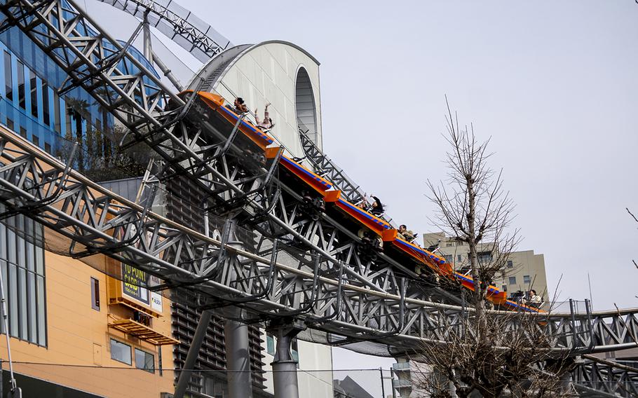 Passengers scream as they zoom past an on-ride photo section at Thunder Dolphin, a 90-second powerhouse of a roller coaster at Tokyo Dome City Attractions in the heart of Tokyo. 