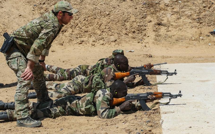 A U.S. Army Special Forces weapons sergeant observes a Niger Army soldier during marksmanship training as part of Exercise Flintlock 2017 in Diffa, Niger, Feb. 28, 2017.
