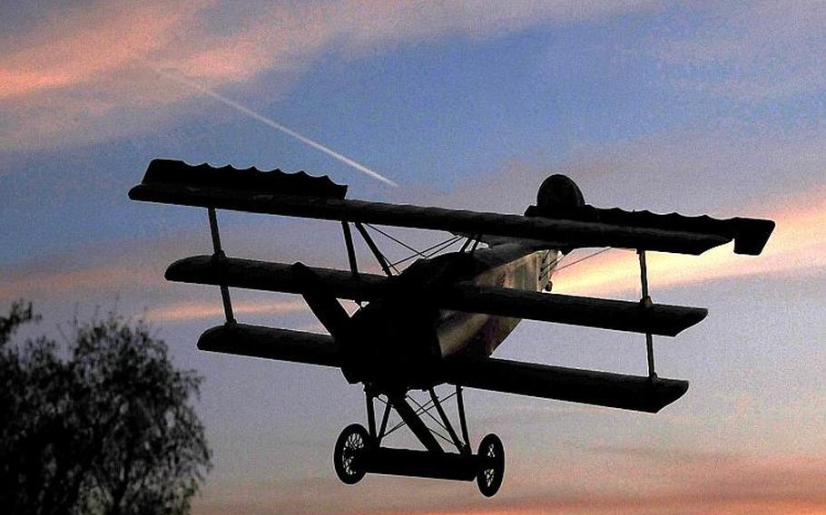This is a model of Manfred von Richthofen's famous Dr.I triplane, photgraphed in front of the evening sky over Wiesbaden, commemorating the 100th anniversary of the death of the Red Baron in 1918 in France. 
                
