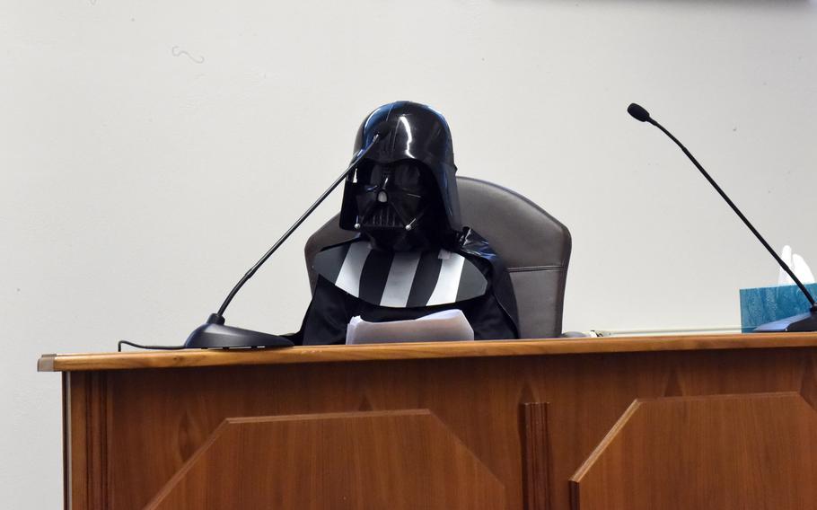 Darth Vader, played by fourth-grader Xavier Maul, on the witness stand at a mock trial in Vilseck, Germany, Tuesday, May 1, 2018.
