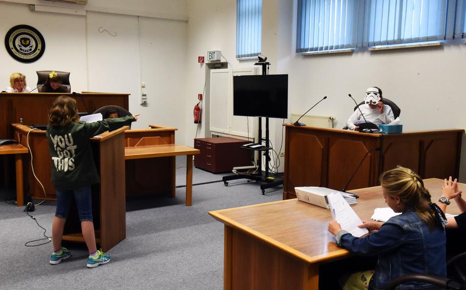 A Stormtrooper, played by fourth-grader Bobby Silva, is cross-examined by the defense during the mock trial of Luke Skywalker in Vilseck, Germany, Tuesday, May 1, 2018.