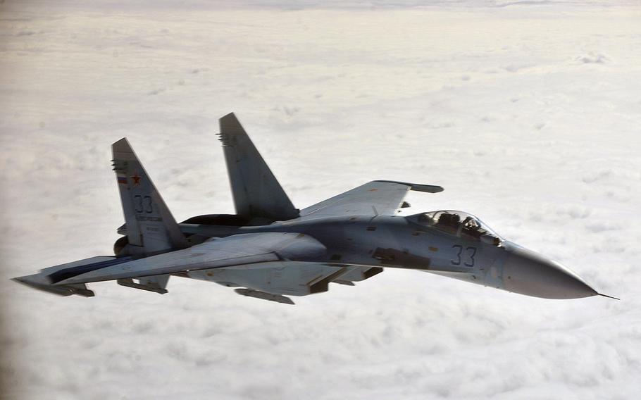 A Russian Su-27 flies near Alaska in 2013. Russia's military spending fell for the first time since 1998, according to a report by the Stockholm International Peace Research Institute.
