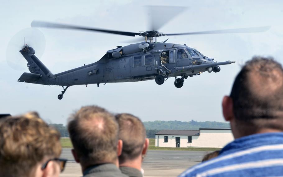 A crowd watches and bids farewell to an HH-60G Pave Hawk helicopter crew of the 56th Rescue Squadron as it flies from RAF Lakenheath, England, to its new duty station at Aviano Air Base, Italy, Tuesday, May 15, 2018.