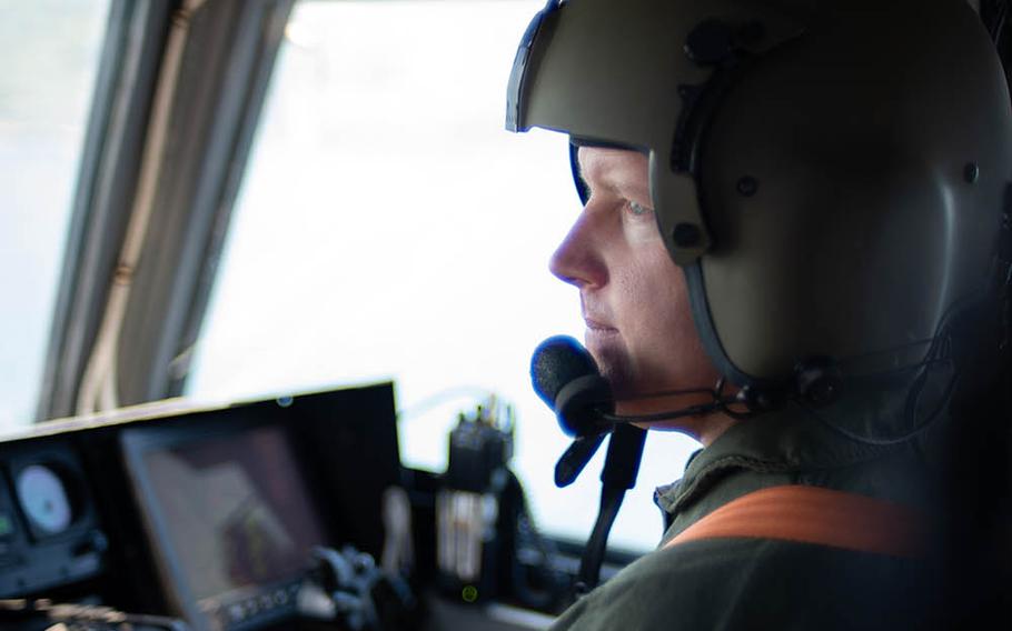 A sailor pilots a landing craft air cushion, or LCAC, near Sasebo Naval Base, Japan, April 19, 2018.