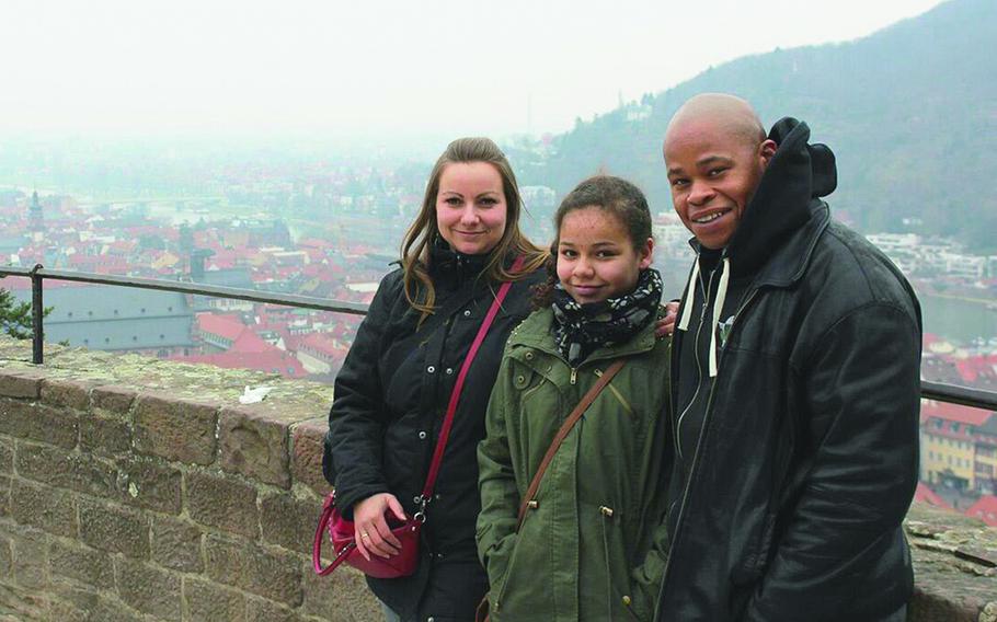 Amber Walker, then 10, stands between her parents, Claudia and Edmond, at Heidelberg Castle in Germany in 2013. Amber was killed on a ride at Holiday Park in Hassloch, Germany, in August 2014. Germany's highest court cleared the supervisors of an operator at Holiday Park, who previously were found guilty of criminal negligence in the death.