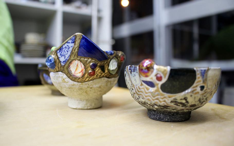 More intricate designs of kintsugi, like the ones shown here at Kuge Crafts in Tokyo, incorporate glass beads and gemstone embellishments to create a mosaic effect to the repair of the item.