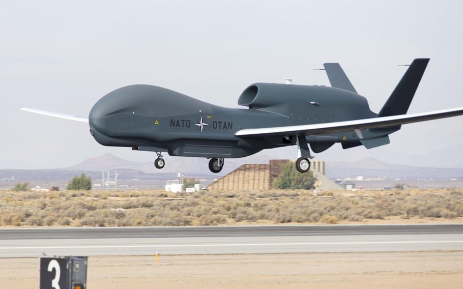 A NATO Alliance Ground Surveillance aircraft arrives at Edwards Air Force Base, Calif., Dec. 19, 2015, completing its first flight. Italy will host NATO surveillance drones in Sicily to bolster the alliances overall situational awareness, the alliance announced Monday. NATO's AGS is a derivative of the wide-area surveillance RQ-4 Global Hawk.
