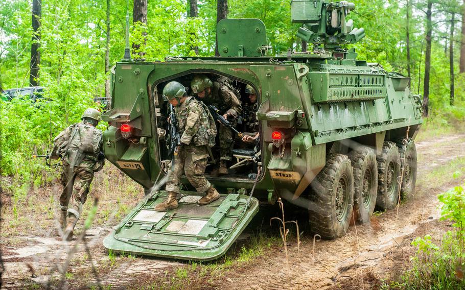 Infantry soldiers-in-training assigned to Alpha Company, 1st Battalion, 19th Infantry Regiment, 198th Infantry Brigade, dismount a Stryker vehicle while conducting a complex attack during field training at Fort Benning, Ga., May 1, 2017. The Army has announced it will extend its one-station unit training for infantry soldiers from 14 weeks to 22 weeks.
