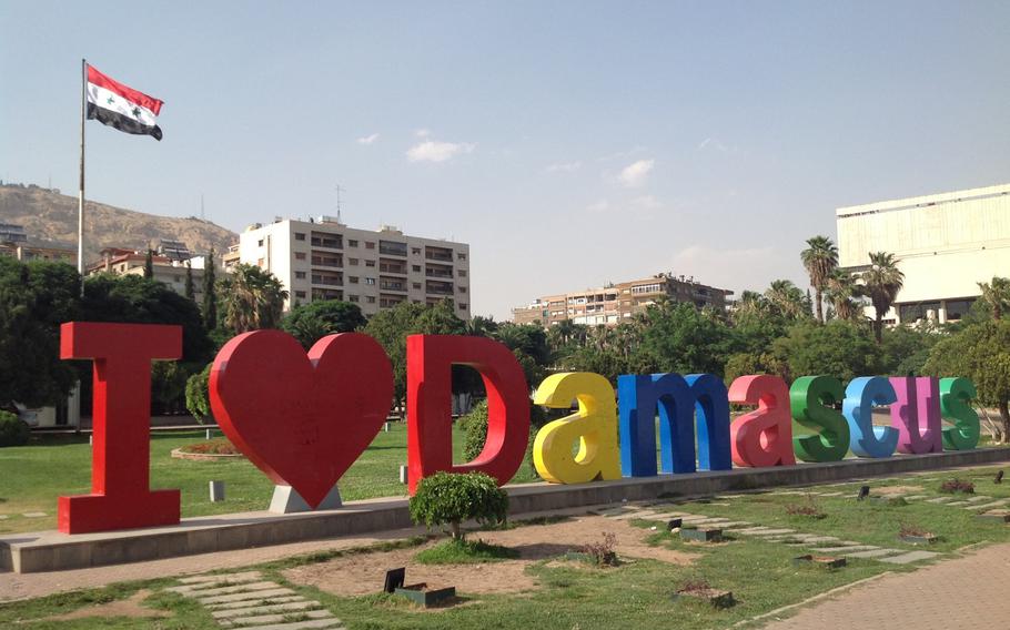 A large new sign in a municipal park in Damascus reflects the return to normal life in Syria's capital city.