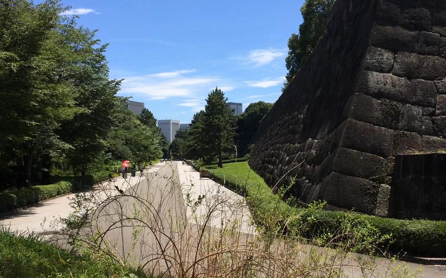 Visitors take a stroll through the East Gardens of the Imperial Palace grounds in Tokyo, Japan. Free entry to the gardens is offered year-round and in springtime, the cherry blossoms onsite draw a big crowd.