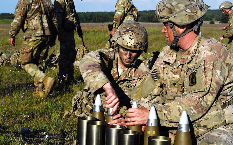 Paratroopers with the 173rd Brigade Combat Team get artillery rounds ready for an artillery live-fire exercise at Grafenwoehr, Germany, Friday, May 18, 2018. A YouGov survey has found that a plurality of Germans want U.S. troops to withdraw from the country.