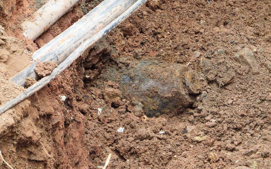 An unexploded 250-pound U.S. bomb from World War II sits buried in the dirt of a construction site near Smith Barracks on U.S. Army Garrison Baumholder on the morning of July 12, 2018. A local Explosive Ordinance Disposal Team excavated then removed the bomb the same day.