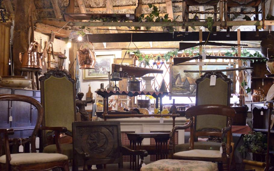 One of the shopping areas inside the Risby Barn Antique Centre in the village of Risby, England. More than 40 dealers offer a wide range of antiques and collectibles.