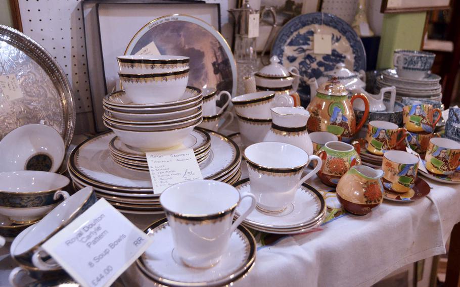 Some of the dinner sets for sale at the Risby Barn Antique Centre in the village of Risby, England. 