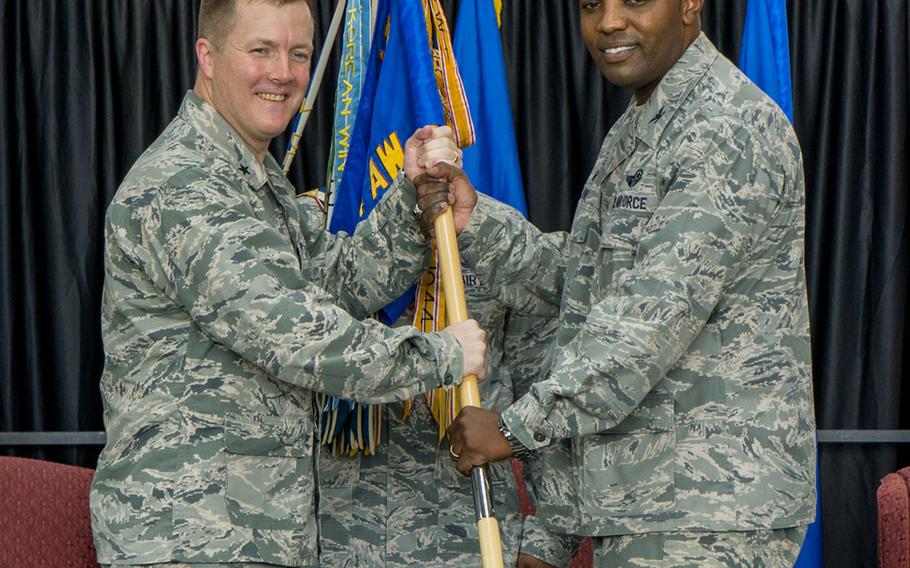 Brig. Gen. Todd Dozier, Fifth Air Force vice commander, left, and Col. Otis Jones, 374th Airlift Wing commander, pause for a photo during the passing of the guidon at Yokota Air Base, Japan, Friday, July 20, 2018.