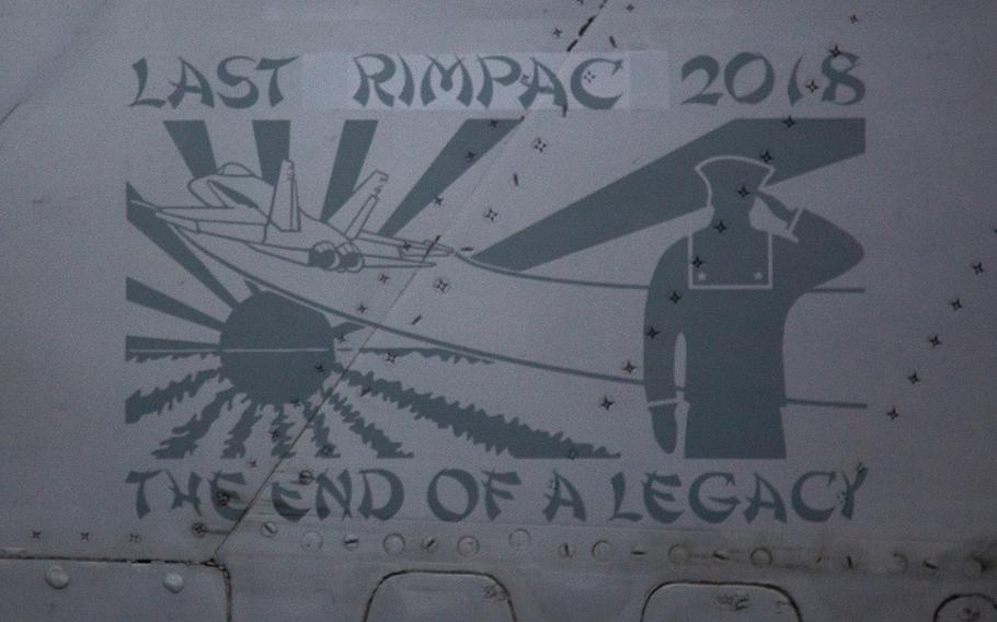"Last RIMPAC 2018," is plastered onto the tail of an F/A-18C Hornet from Strike Fighter Squadron 34 aboard the USS Carl Vinson near Hawaii, Saturday, July 21, 2018.