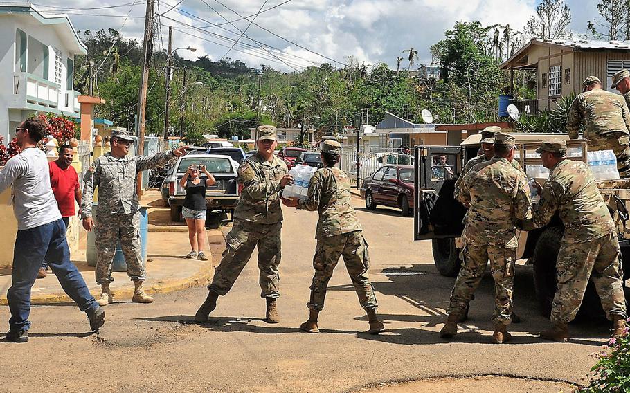 Soldiers of the Puerto Rico Army National Guard's 92nd Military Police Brigade distribute supplies, food and water to affected communities around the island of Puerto Rico in the aftermath of Hurricane Maria, Nov 2, 2017. 
                