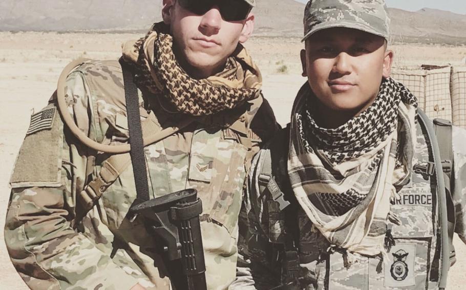 This photo was posted on a GoFundMe page for the family of Airman 1st Class Mikhahael Ragay (right), who suffered a severe heat injury during training at Osan Air Base, South Korea.