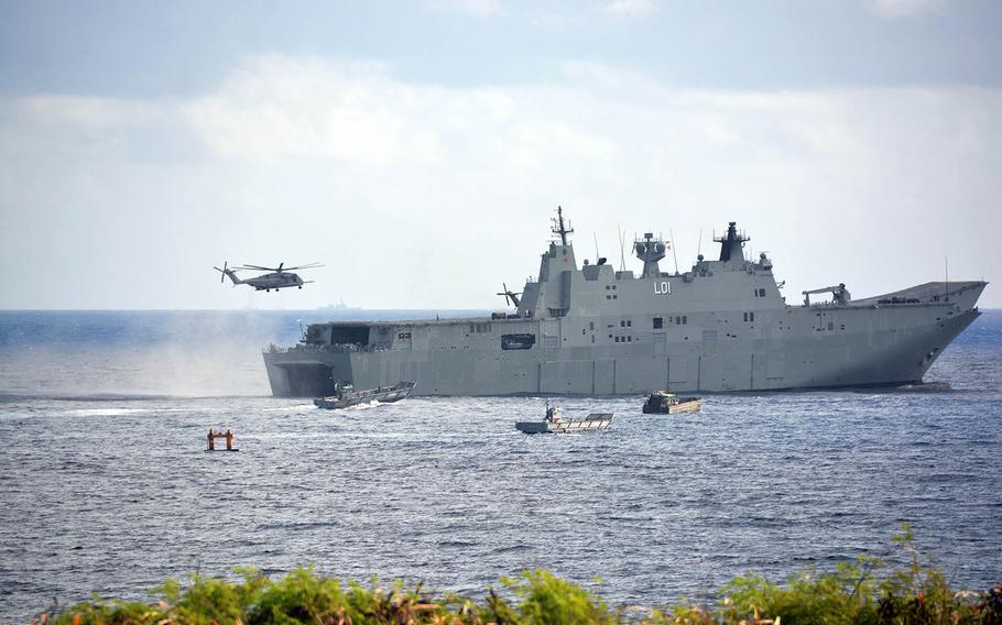 A Marine Corps Super Stallion lands aboard the HMAS Adelaide during Rim of the Pacific drills off the shore of Marine Corps Base Hawaii, Sunday, July 29, 2018.