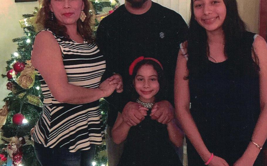 Alejandra and Temo Juarez and their daughters Estela, left and Pamela celebrate Christmas 2017 in Florida. Alejandra is facing deportation to Mexico this week after 20 years in the country as a military wife and mother of two American daughters.
                