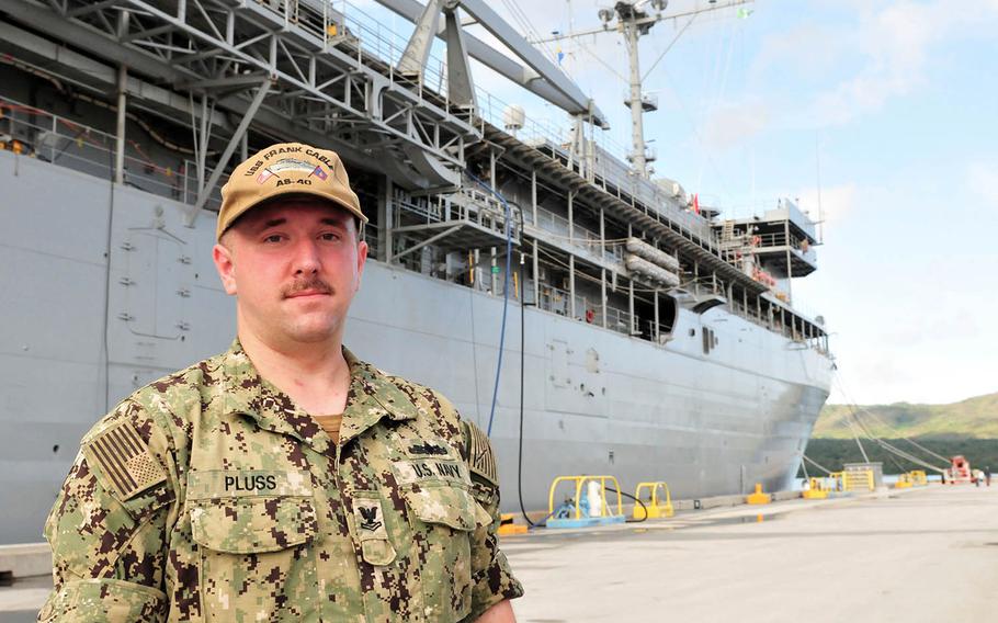 Petty Officer 2nd Class Andrew Pluss of the submarine tender USS Frank Cable was awarded the Navy and Marine Corps Achievement Medal for his actions after a fatal car crash last month on Guam.