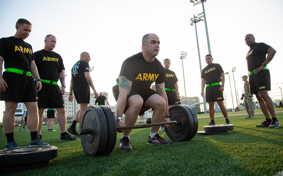 A soldier from the 1st Armored Combat Brigade, 3rd Infantry Division attempts a deadlift during a demo of the new Army Combat Fitness Test at Camp Humphreys, South Korea, Tuesday, July 31, 2018.
